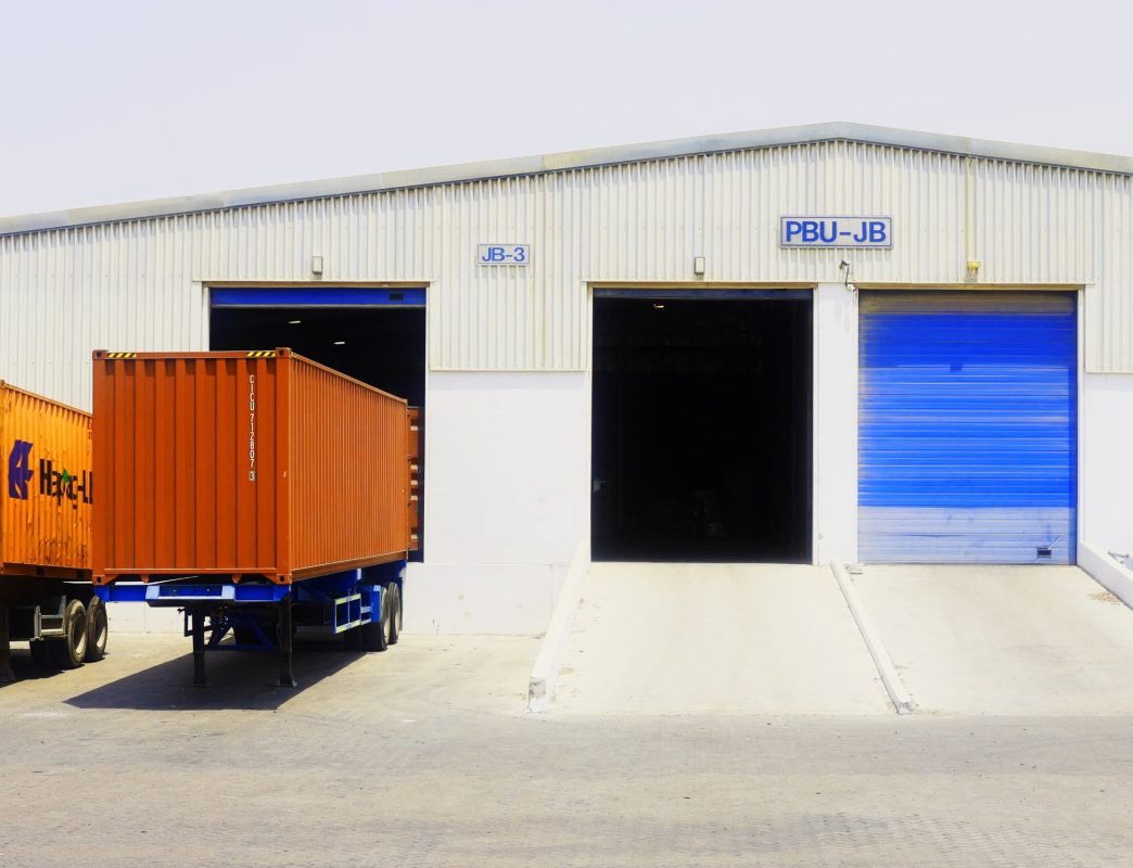 International container loading at auto parts export warehouse