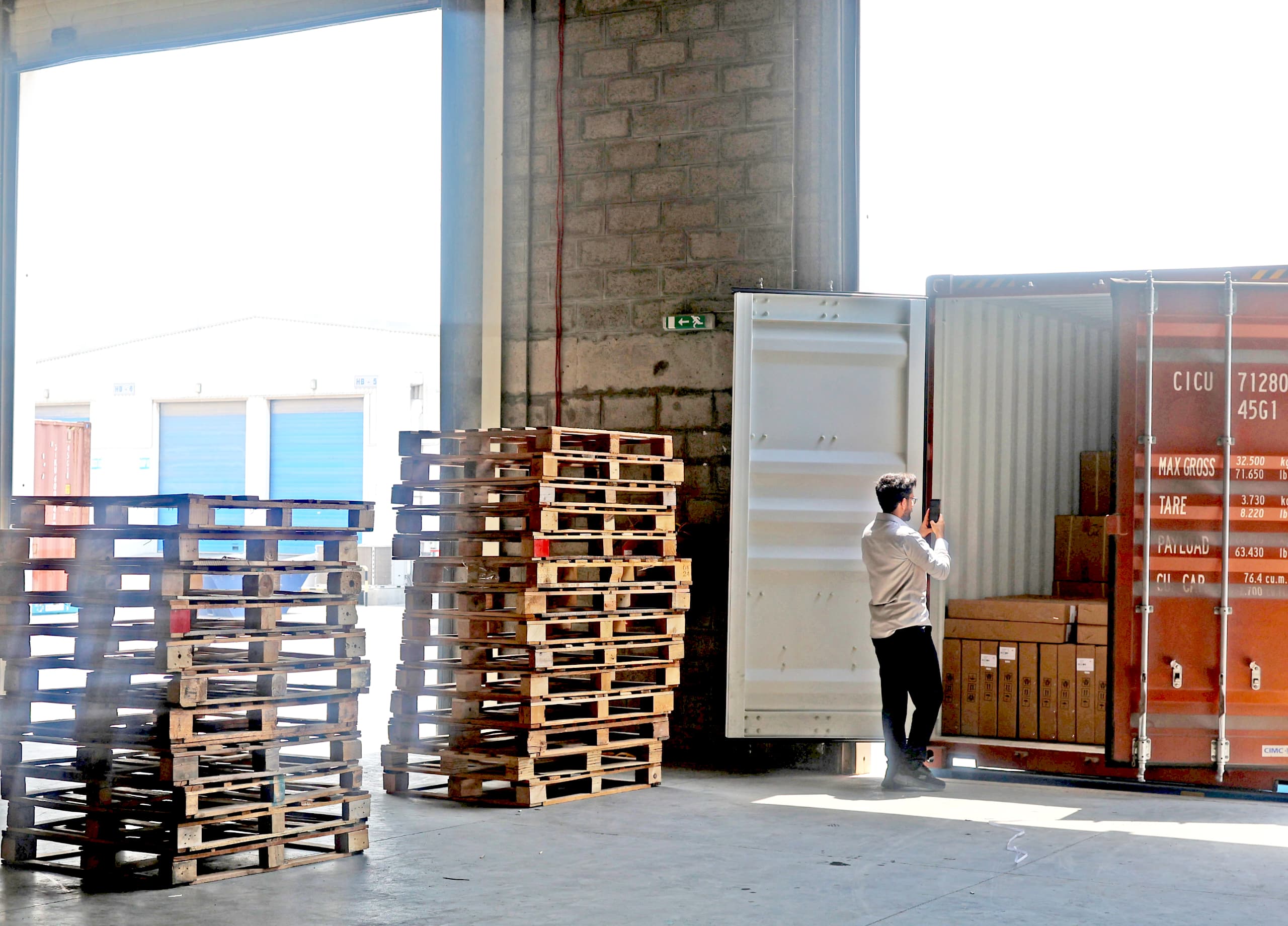 Export packaging and container loading inside auto parts warehouse